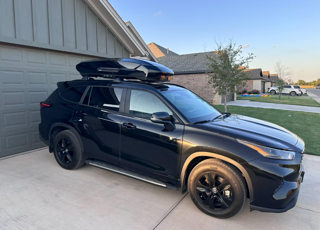 Thule Motion 3 XL mounted on gray Toyota Prius Prime sedan showing full vehicle profile